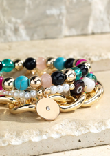 This three-piece bracelet set is a gem! The natural stones, acrylic, glass, metal and pearl combine to create a look of fascination and glamour. With each one measuring 8.25" and a diameter of 2.5", you can rock the world with this stunning set! Nickel/Lead compliant, this jewelry is sure to make a statement.