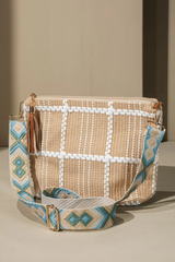 Add a little flair to your outfit with this check print crossbody bag! Its checkered pattern and embroidered unique pattern will certainly make a statement. Plus, you can adjust the detachable strap to make sure it fits you perfectly. Fun and practical - what more could you ask for?  *100% Polyester *APPROX. L 8" W 12" D 4" Adjustable shoulder strap