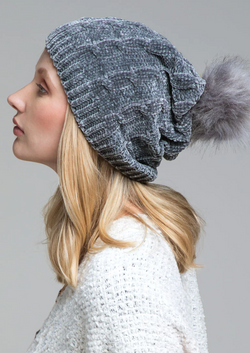 Stay warm (and stylish!) in this luxe chenille cable knit beanie! With its soft faux-fur pom-pom accent, this beanie is the perfect way to stay cozy this winter!  Keep the cold out and your cool in with this beanie - wooly bliss for your noggin!