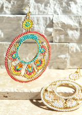 Make a statement with these dazzling Boho Seed Bead Circle Drop Earrings! Show off your unique style with their stunning detailed ethnic design that's sure to impress! Crafted with 50% glass beads and 50% iron metal and Nickel/Lead Compliant, these gorgeous 3" long, 2.25" wide earrings are the perfect pair for any trendsetter!