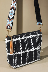 Add a little flair to your outfit with this check print crossbody bag! Its checkered pattern and embroidered unique pattern will certainly make a statement. Plus, you can adjust the detachable strap to make sure it fits you perfectly. Fun and practical - what more could you ask for?  *100% Polyester *APPROX. L 8" W 12" D 4" Adjustable shoulder strap