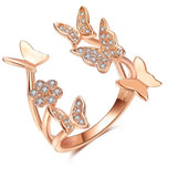 Fly away in style with the Flutter Of Butterflies Ring! This delicate, open ring is slightly adjustable to fit your finger to a T and is available in both rose gold and white gold. Plus, it's adorned with sparkling CZ diamonds/stones that really give it some sparkle! Flutter away in chic fashion!